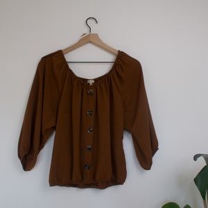 brown button down off shoulder shirt